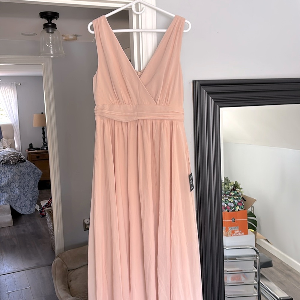 Never worn , could be a perfect bridesmaid dress, prom or to just dress up
